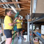 Monica Beistline of Bechtelsville and Pastor Scott Campbell of the Birdsboro Church of the Nazarene assemble brooms in the supply shed at St. Mark's Lutheran Church in Birdsboro during Mission Trip Birdsboro on Thursday, July 16, 2026. (BILL UHRICH/READING EAGLE)