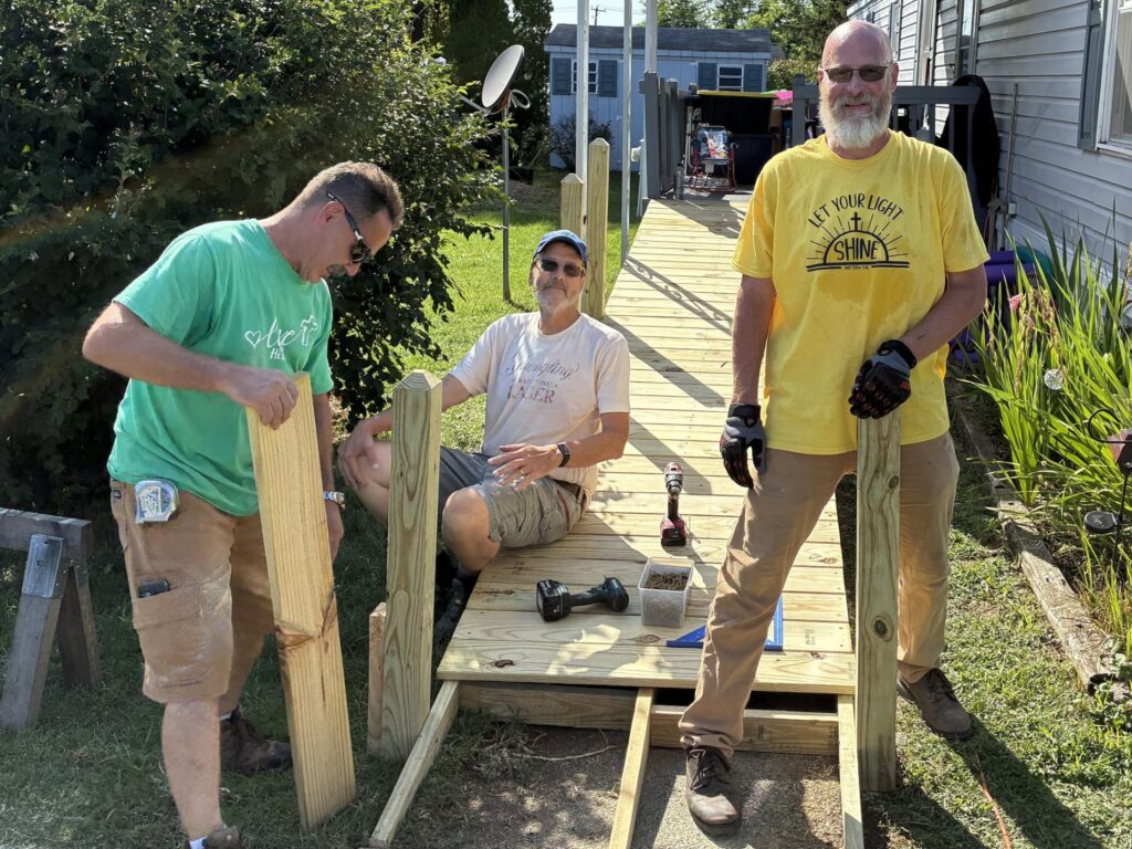 From left, Richie Boden, Joe Hill, and Fred Schoppe work on a wheelchair ramp as part of the Birdsboro Shares ministry. (Photo courtesy of Stuart Wells)